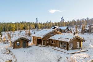 eine Luftansicht eines Blockhauses im Schnee in der Unterkunft Trysilsetra 35 in Trysil