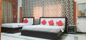 Postel nebo postele na pokoji v ubytování Hotel New View Guest House