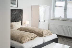 Ένα ή περισσότερα κρεβάτια σε δωμάτιο στο Black & White