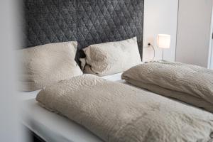 Ένα ή περισσότερα κρεβάτια σε δωμάτιο στο Black & White