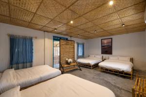 Ένα ή περισσότερα κρεβάτια σε δωμάτιο στο Xóm Chài Tân An +70 φωτογραφίες