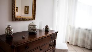 a dresser in a room with a mirror at Villa Gemma in Alba +40 photos