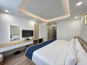 Ένα ή περισσότερα κρεβάτια σε δωμάτιο στο Hali Hotel Da Lat