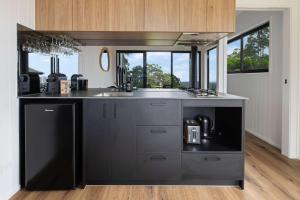 a kitchen with a sink and a counter top at Grevillea Villa in Valdora