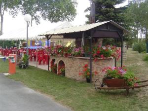 a flower market with a cart with flowers in it at ZEcamping 4 étoiles dog friendly bar piscine couverte in Faverolles-sur-Cher +47 photos