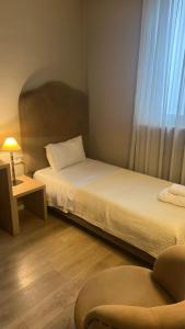 Ένα ή περισσότερα κρεβάτια σε δωμάτιο στο Hotel Hermes T