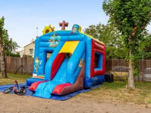 a childs play equipment in a park at Camping 3 étoiles - Piscine - ccbafeb in Avrillé