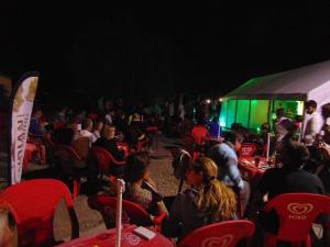 a large group of people sitting in chairs at night at ZEcamping 3 étoiles animé animaux acceptés familial piscine couverte in Avrillé