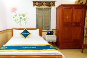 Ένα ή περισσότερα κρεβάτια σε δωμάτιο στο Hà Thành Motel Bắc Ninh