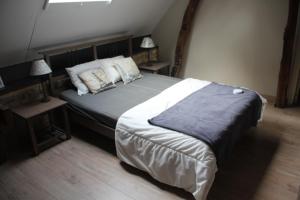 Postel nebo postele na pokoji v ubytování Grange de Pierrot