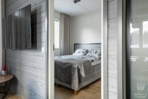 Postel nebo postele na pokoji v ubytování Holiday in Lapland - Postintie 3 A 6103