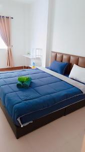 Ένα ή περισσότερα κρεβάτια σε δωμάτιο στο Pai Baan Family