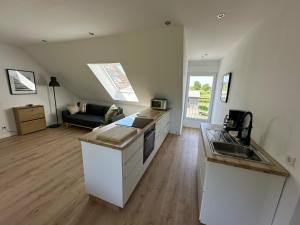 TV a/nebo společenská místnost v ubytování Monteurwohnung - Ferienwohnung