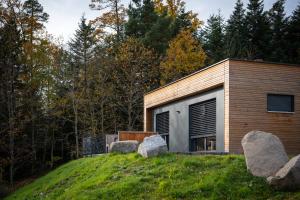 a house on top of a hill with rocks at Domaine de Haslach, The Originals Collection, Résidence de Tourisme in Munster +49 photos