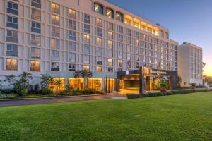 a large building with a lawn in front of it at InterContinental Lusaka by IHG in Lusaka