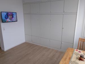 TV a/nebo společenská místnost v ubytování Studioappartement Wegg Wilhelmstraße