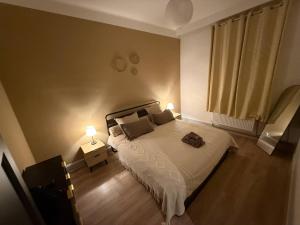 Ένα ή περισσότερα κρεβάτια σε δωμάτιο στο L'Élégance – Cosy & Chill