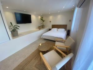 TV a/nebo společenská místnost v ubytování Ecrin des sens