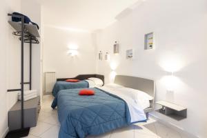 Postel nebo postele na pokoji v ubytování Camere Margot