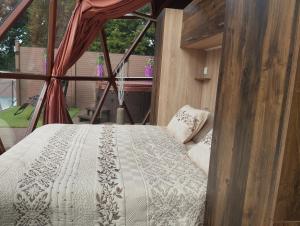 a bedroom with a bed in a room with a window at Glamping Bříza in Cheb +64 photos