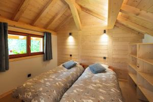 Ένα ή περισσότερα κρεβάτια σε δωμάτιο στο Chalet des Plans - Vallée Chamonix