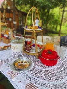 a table with plates of food on top of it at Baanlamun in Ban Dong Bang