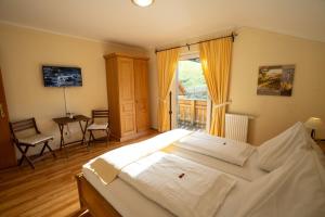 Ένα ή περισσότερα κρεβάτια σε δωμάτιο στο Chalet Olympia