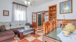 a living room with a couch and a glass table at Villa Josara by Ruralidays in Huelva