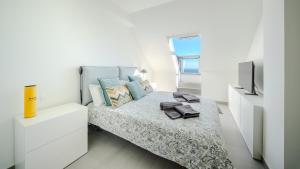 Ένα ή περισσότερα κρεβάτια σε δωμάτιο στο AticoBLU +16 φωτογραφίες