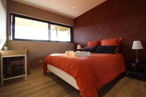 En eller flere senge i et værelse på Gîte Au Camp de Base vue panoramique