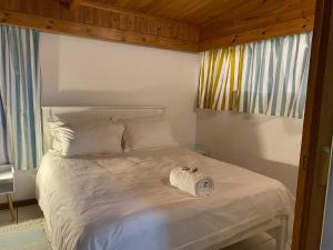 Кровать или кровати в номере Muizenberg Sea Search Self Catering