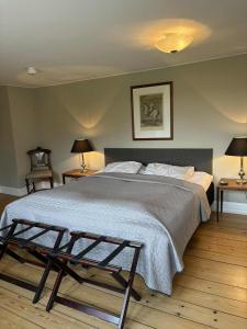 Ένα ή περισσότερα κρεβάτια σε δωμάτιο στο Risinge Herregård