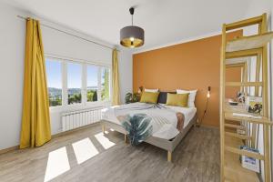 a bedroom with a bed and a large window at Villa vue mer panoramique & piscine chauffée in Toulon +71 photos