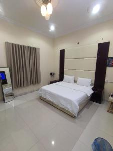 Ліжко або ліжка в номері روعة أجا للشقق المخدومة