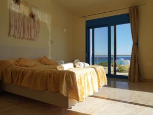 Voodi või voodid majutusasutuse VILLES RANIA toas +28 fotot