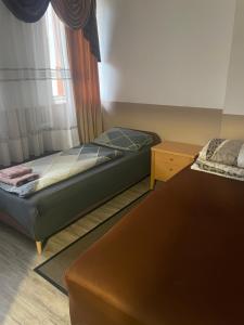 a bedroom with two beds and a window at LIVI Hostel und Pension in Dortmund