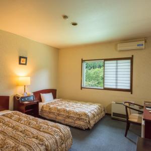 Voodi või voodid majutusasutuse Livemax Resort Hida Takayama Garyu no Sato toas