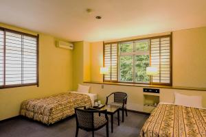 Voodi või voodid majutusasutuse Livemax Resort Hida Takayama Garyu no Sato toas +13 fotot