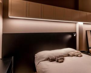 Ένα ή περισσότερα κρεβάτια σε δωμάτιο στο Baciucco Garden Suite