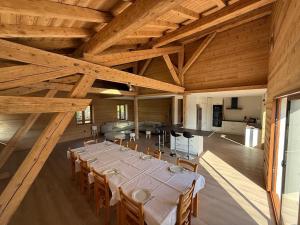a large room with a long table and chairs at Chalet école des cimes in Bozel