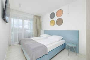 En eller flere senge i et værelse på Westin House Koralowa by Solarento