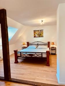 a bedroom with a bed in a attic at Fewo Geib in Meisenheim