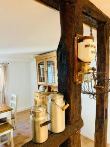 a kitchen with three metal pots on a table at Fewo Geib in Meisenheim