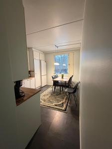 a kitchen and dining room with a table and chairs at A great apartment for daily or weekly rent 60m in Espoo