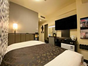 Ένα ή περισσότερα κρεβάτια σε δωμάτιο στο APA Hotel Hachioji Eki Kita