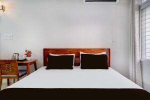 Postel nebo postele na pokoji v ubytování Hotel O La Vita Oasis