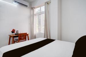 Postel nebo postele na pokoji v ubytování Hotel O La Vita Oasis