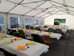 a large tent with tables and chairs in it at Camping 3 étoiles - efb0hg in Arques-la-Bataille