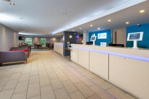 a lobby of a hospital with a waiting room at Holiday Inn Express Exeter East by IHG in Exeter