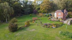 an aerial view of a house with a garden at 3-bedroom cottage set in a large enclosed garden in Thatcham